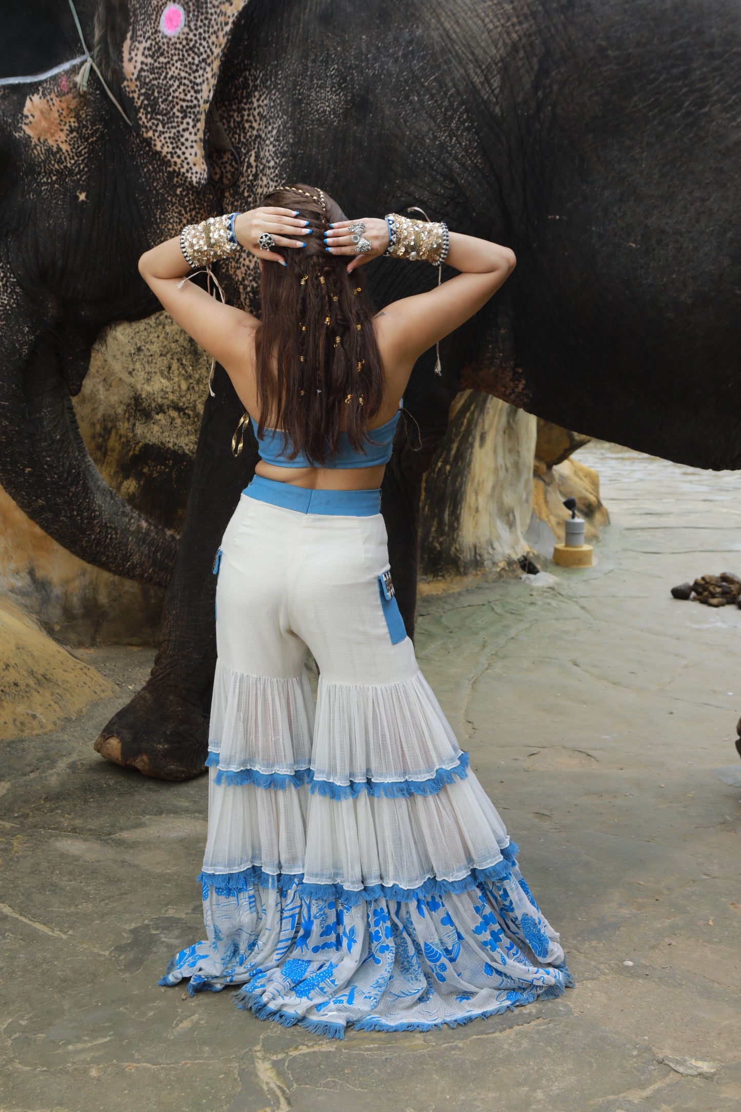 DEVI DRAPE IVORY KOTA DORIA HAND PAINTED SHARARA WITH DENIM EMBELLISHED BUSTIER & CAPE