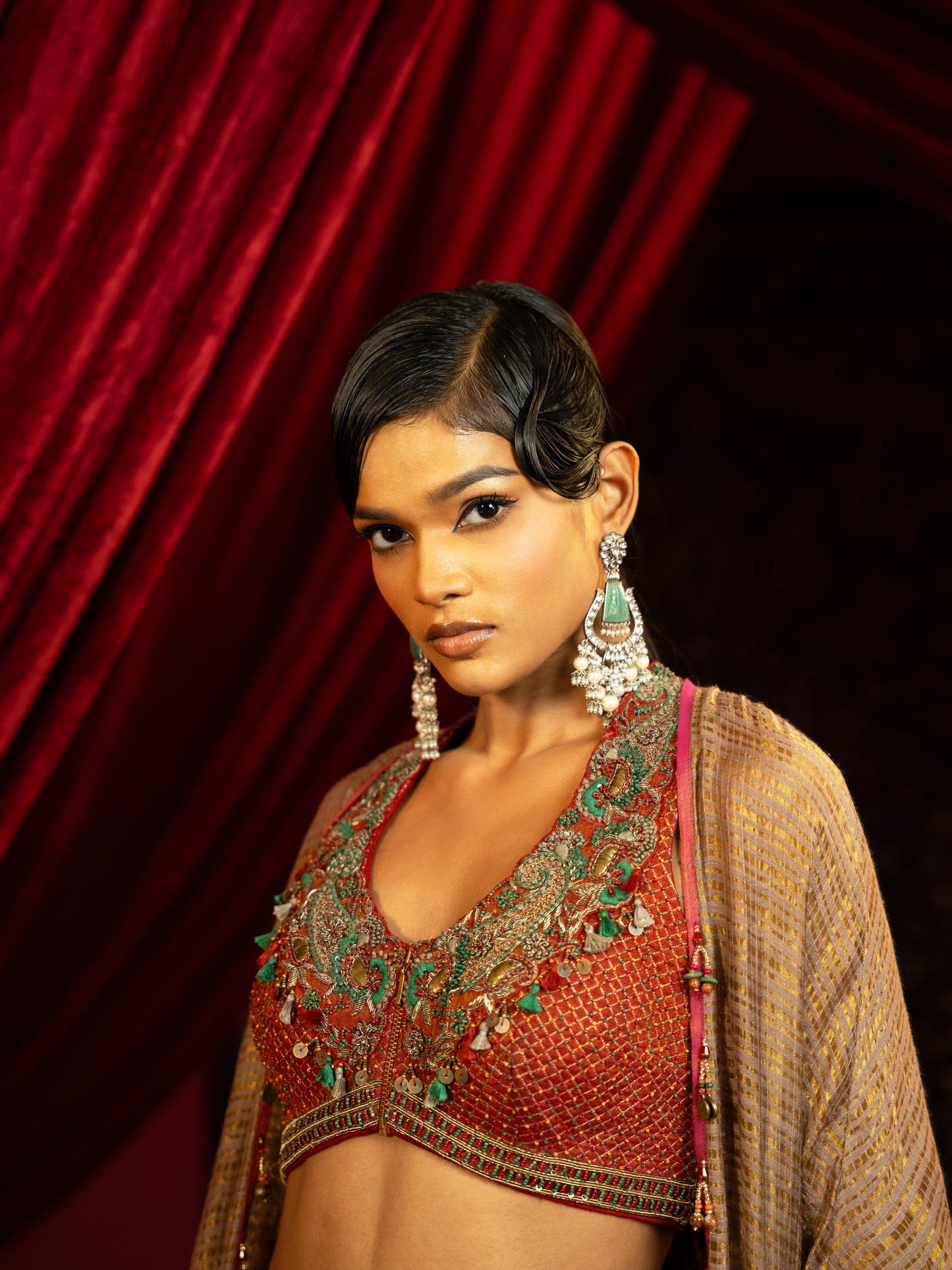 CRIMSON RED QUILTED BLOUSE WITH BOX PLEATED PANTS & SEPIA BROWN CAPE