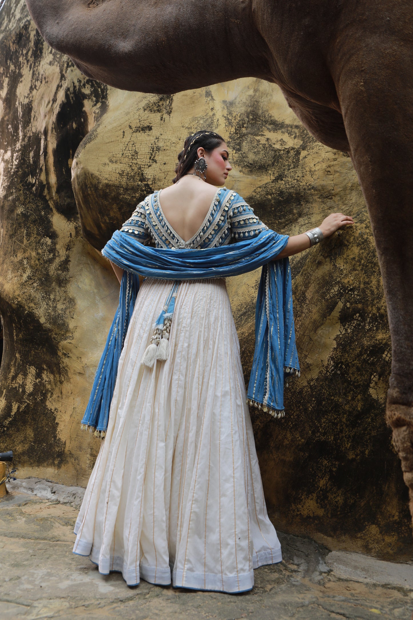 DEVI DRAPE IVORY MAL LEHANGA WITH DENIM LACE EMBELLISHED BLOUSE AND DENIM BLUE CRUSHED DUPATTA
