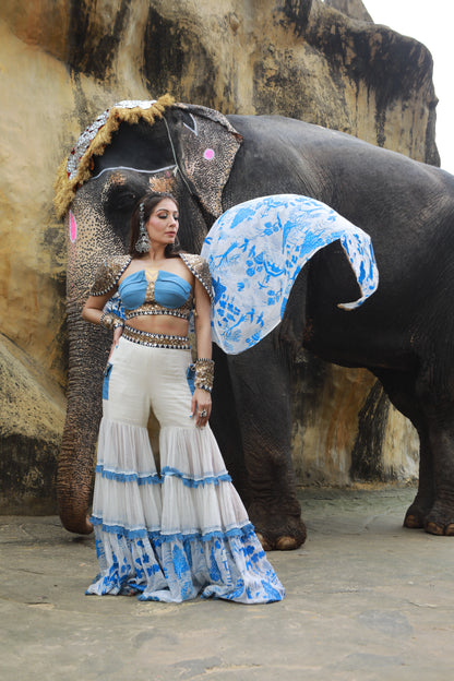DEVI DRAPE IVORY KOTA DORIA HAND PAINTED SHARARA WITH DENIM EMBELLISHED BUSTIER & CAPE