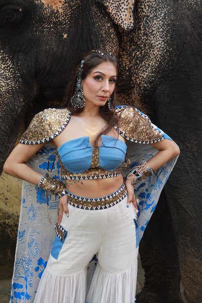 DEVI DRAPE IVORY KOTA DORIA HAND PAINTED SHARARA WITH DENIM EMBELLISHED BUSTIER & CAPE
