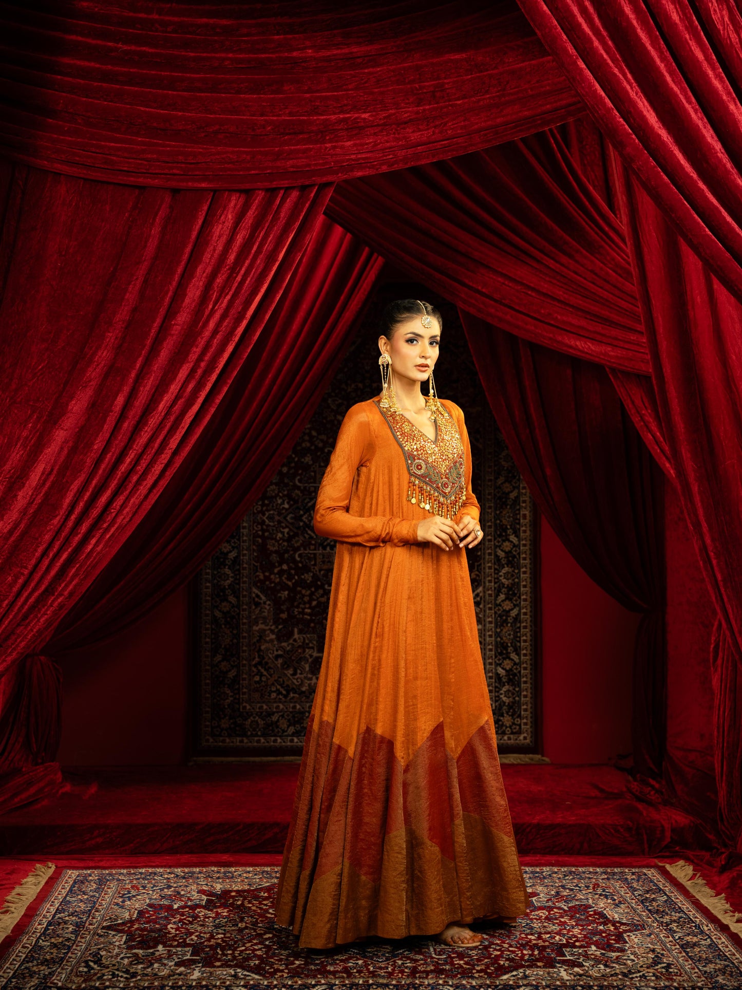 TERRACOTTA RUST ANARKALI GOWN WITH GEOMETRIC HEMLINE