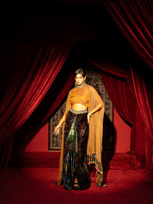 PRINTED VELVET DRAPE SKIRT WITH RUCHED HALTER BLOUSE & FLOWY DUPATTA CAPE