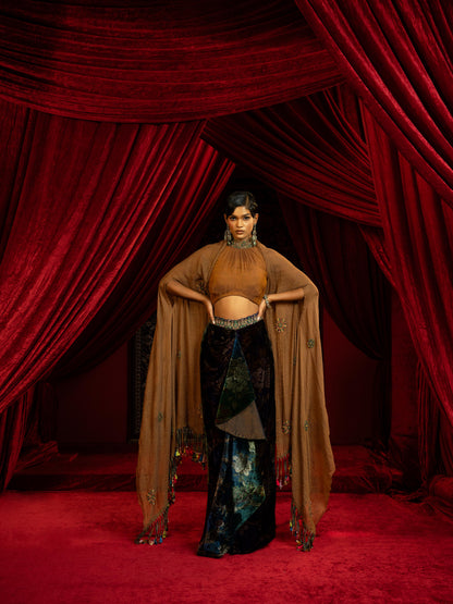 PRINTED VELVET DRAPE SKIRT WITH RUCHED HALTER BLOUSE & FLOWY DUPATTA CAPE