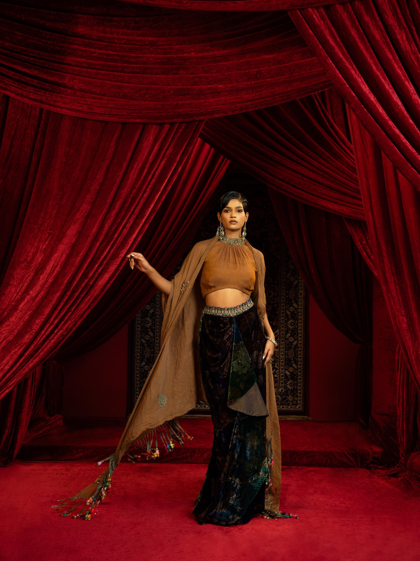 PRINTED VELVET DRAPE SKIRT WITH RUCHED HALTER BLOUSE & FLOWY DUPATTA CAPE
