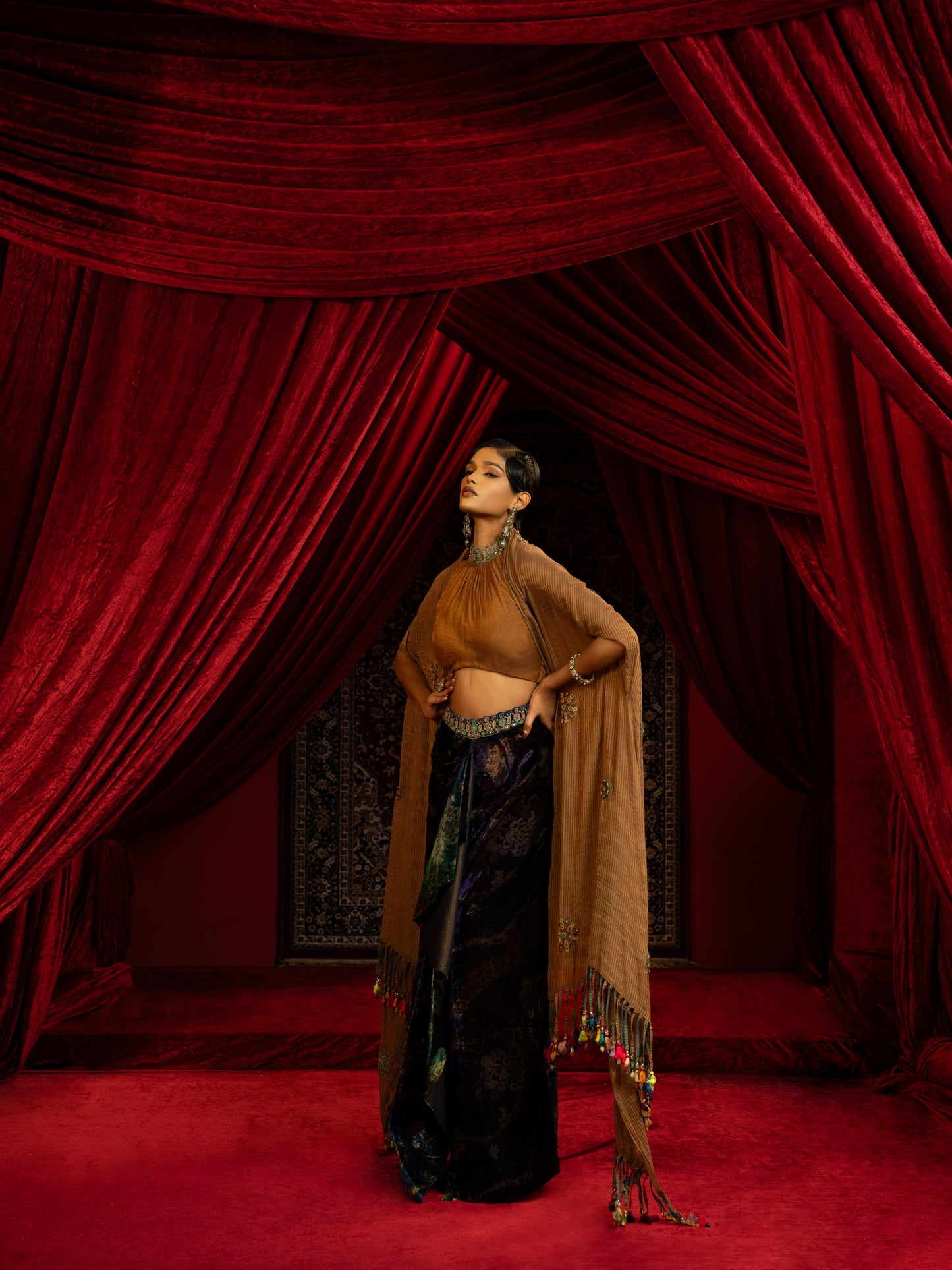 PRINTED VELVET DRAPE SKIRT WITH RUCHED HALTER BLOUSE & FLOWY DUPATTA CAPE
