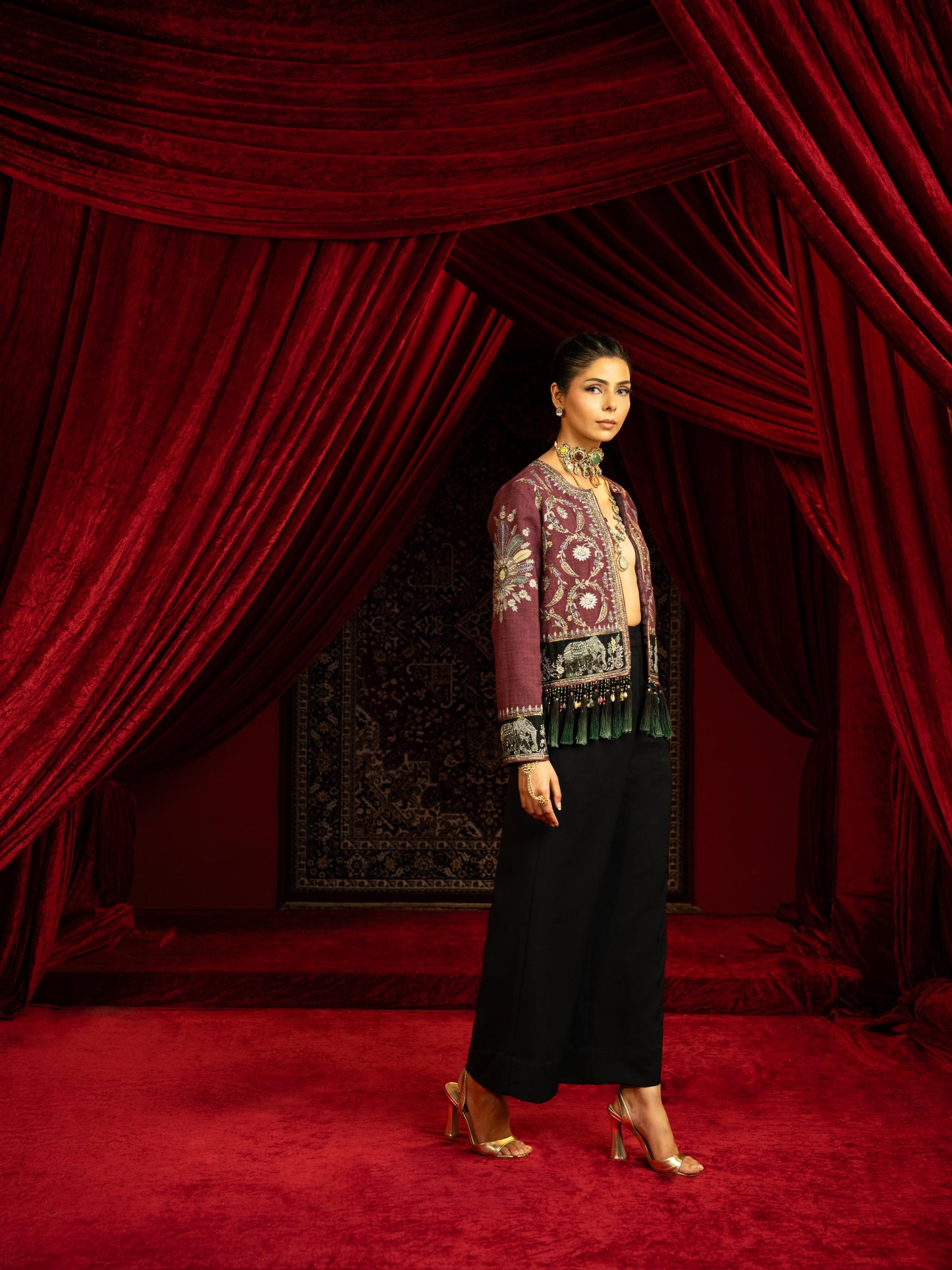 MAUVE EMBROIDERED SHORT JACKET WITH JEWEL BEADS & TASSELS PAIRED WITH BLACK FLARED PANTS