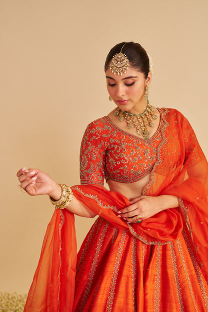 NAAZILA - DABKA ZARDOZI EMBROIDERED RAW SILK BURNT ORANGE LEHENGA SET