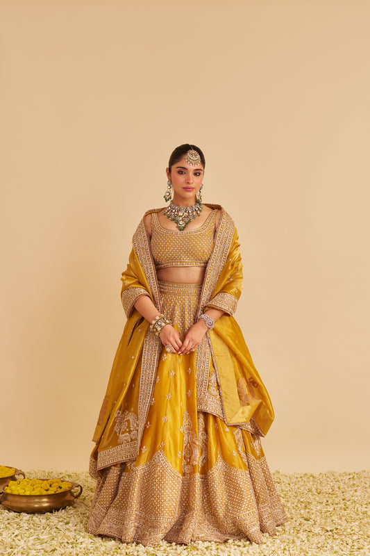 AASHINA - DABKA ZARDOZI EMBROIDERED PURE TISSUE MUSTARD LEHENGA SET