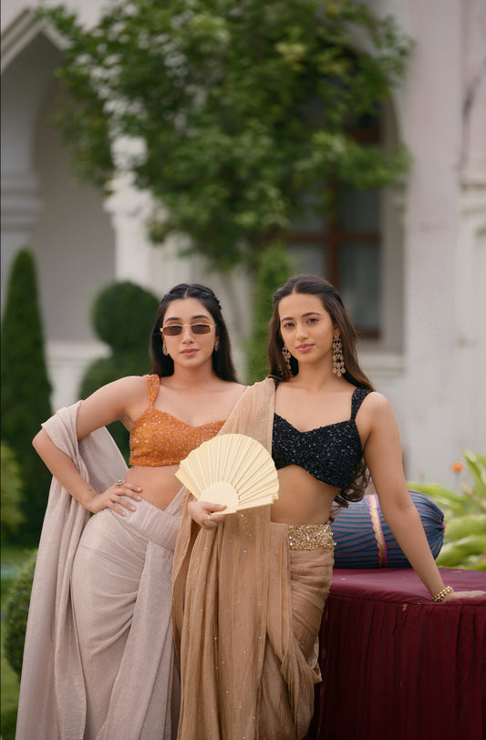 BLACK VELVET SEQUIN BLOUSE PAIRED WITH A GOLDEN CRUSHED TISSUE PRE-DRAPED SAREE